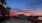 sunset sky with a large ferris wheel