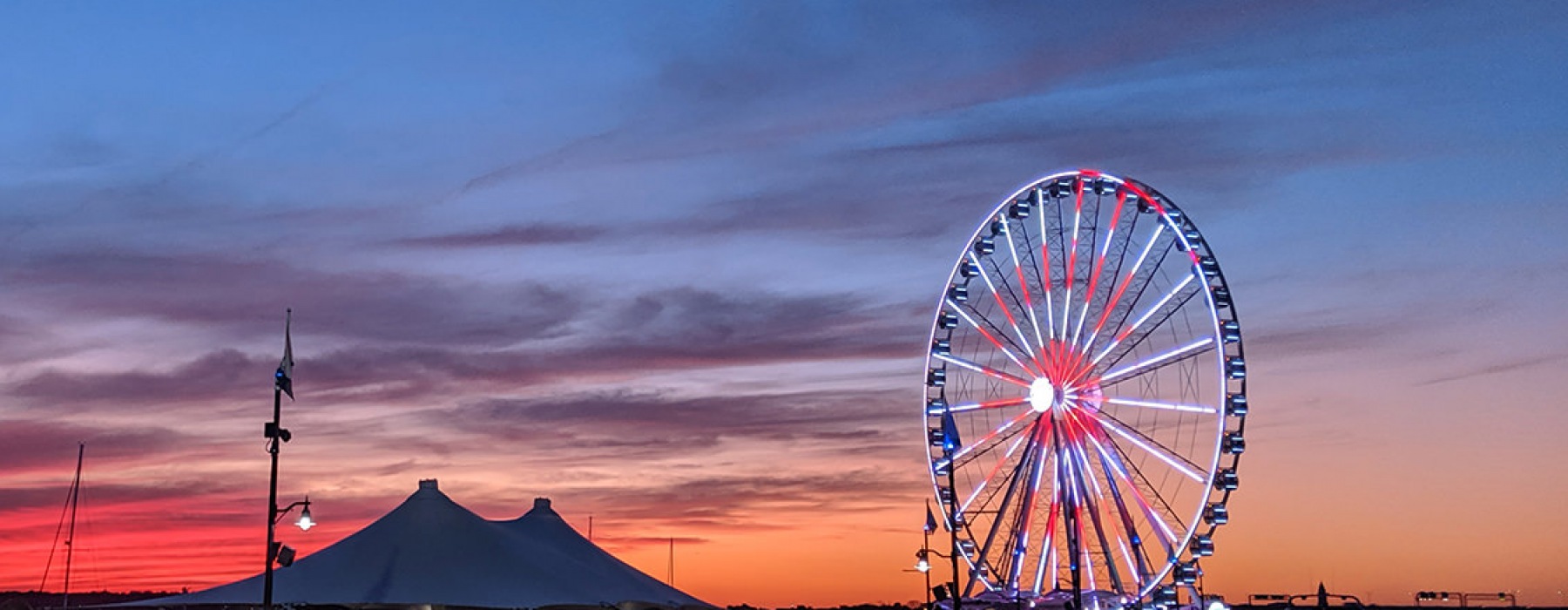 sunset sky with a large ferris wheel