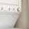 stacked laundry appliances in a narrow closet